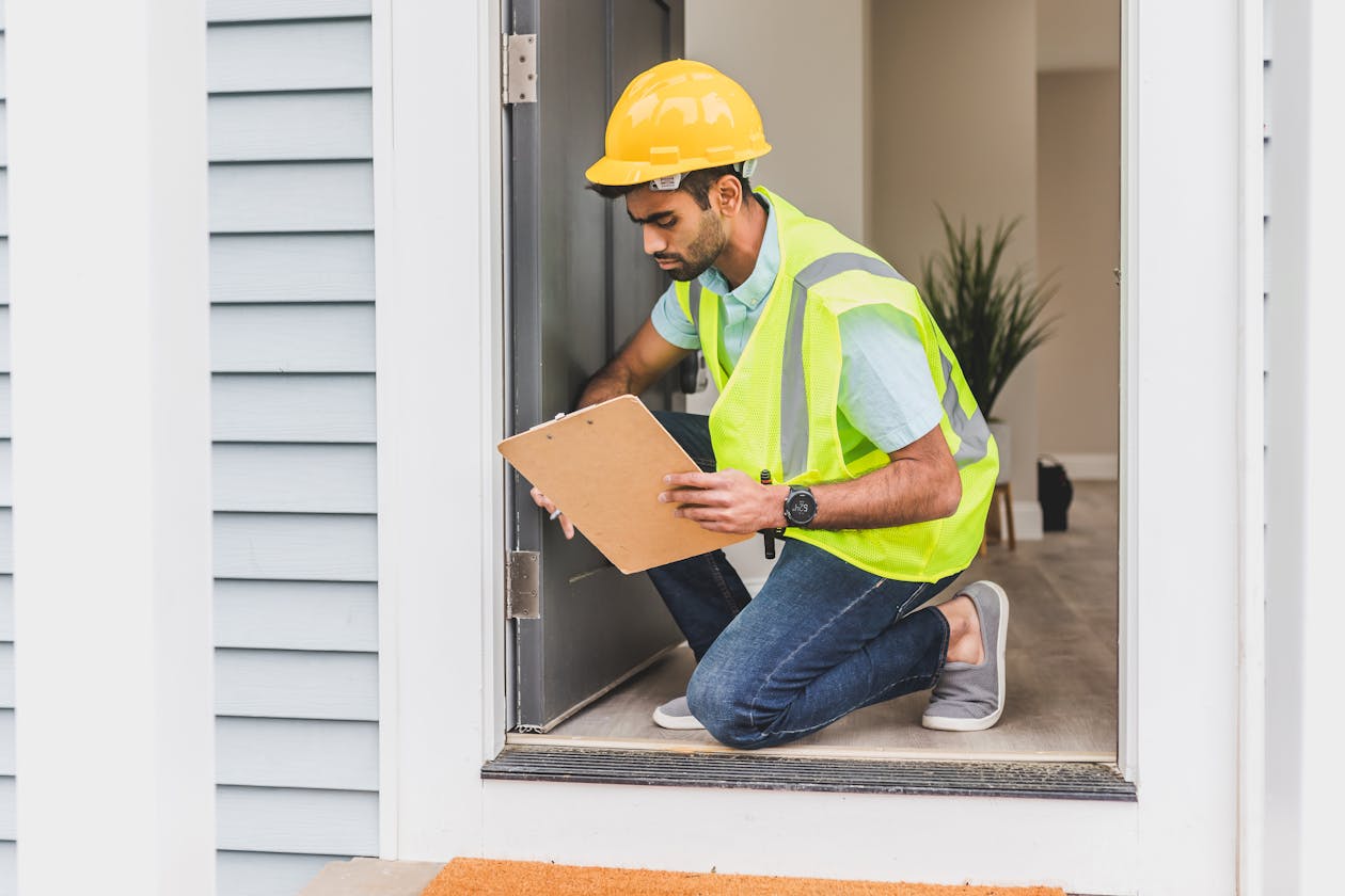 Professional inspecting a home interior